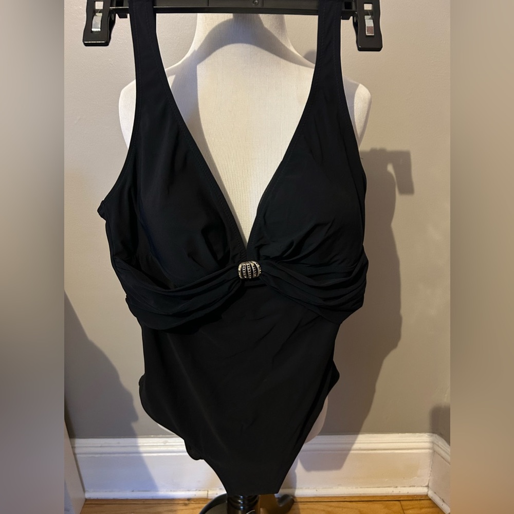 Gottex bathing suit. Black with jewel center piece. Size 14. Good used c…